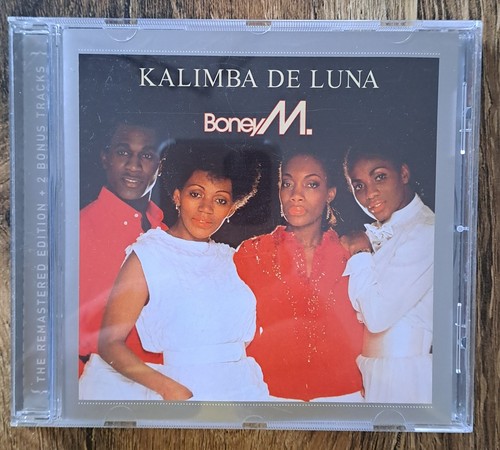 Boney kalimba de luna - •,